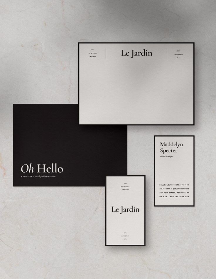 Le Jardin stationery suite with high-contrast serif wordmark on marble